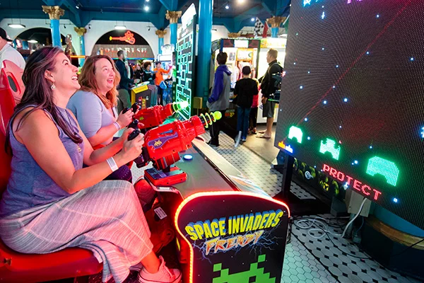 women playing in arcade
