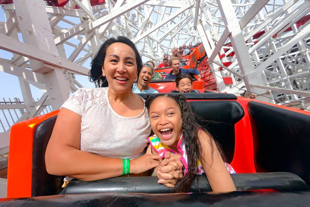 family riding the Giant Dipper