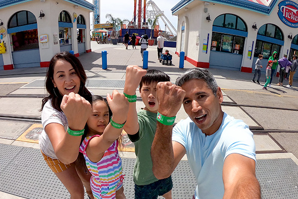 a family showing their wristbands