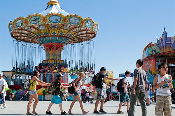 kids with backpacks at the boardwalk